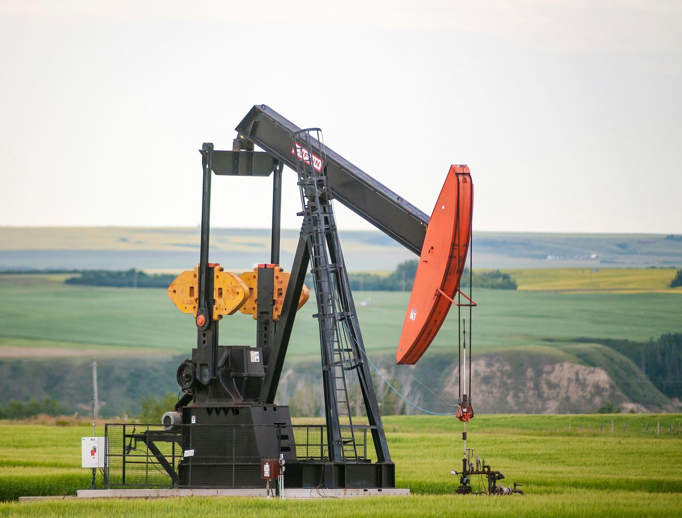 An oil pumpjack on open prairie